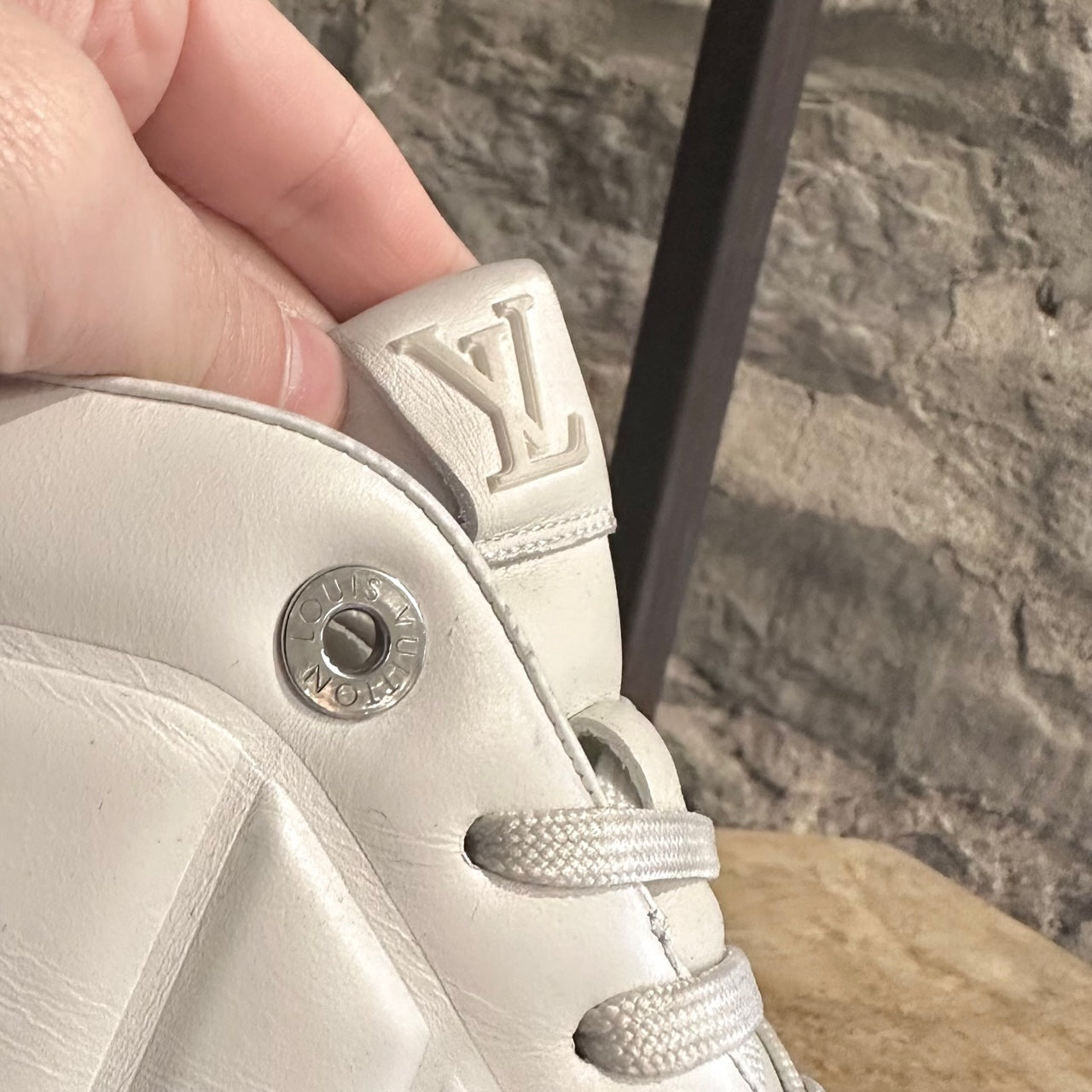 White Louis Vuitton hightop sneakers