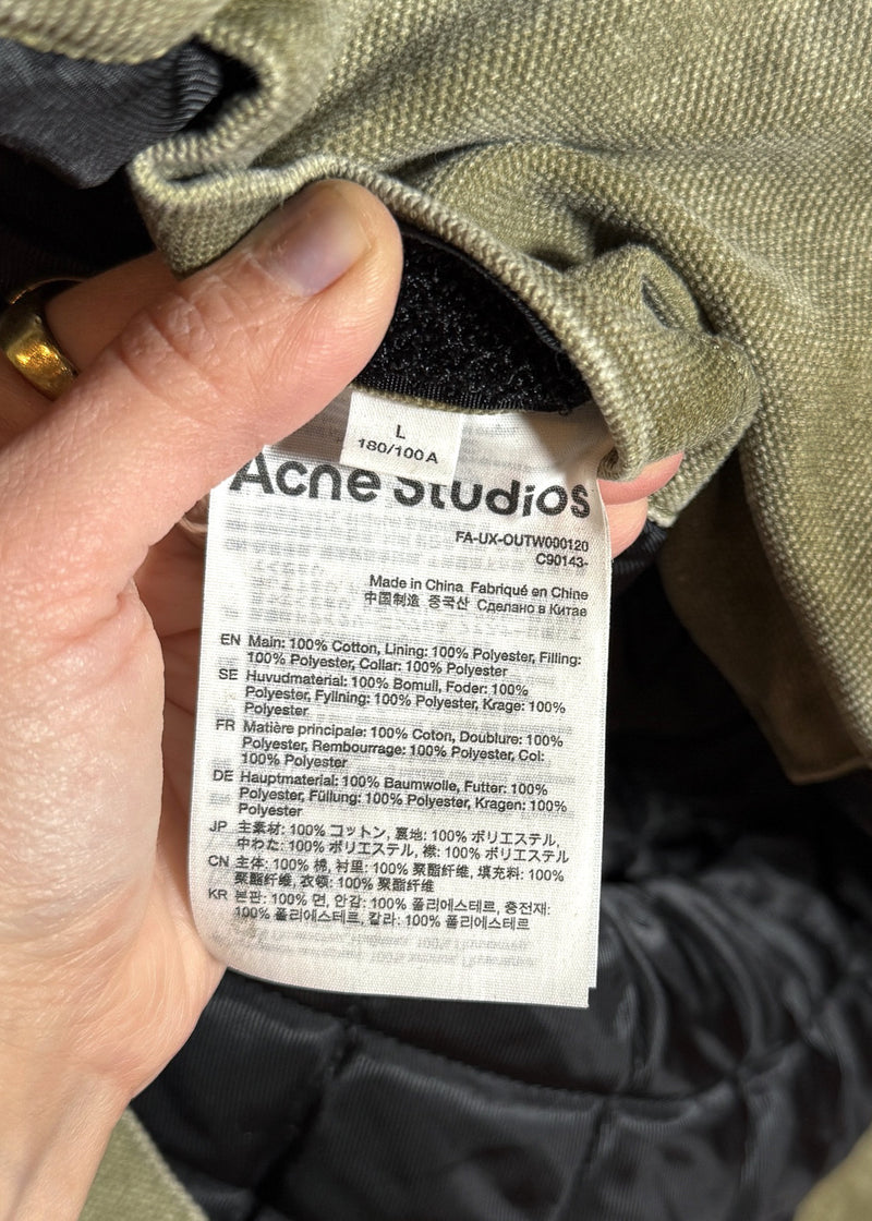 Size and material labels of Acne Studios Green Canvas Faux Shearling Orsan Trucker Jacket