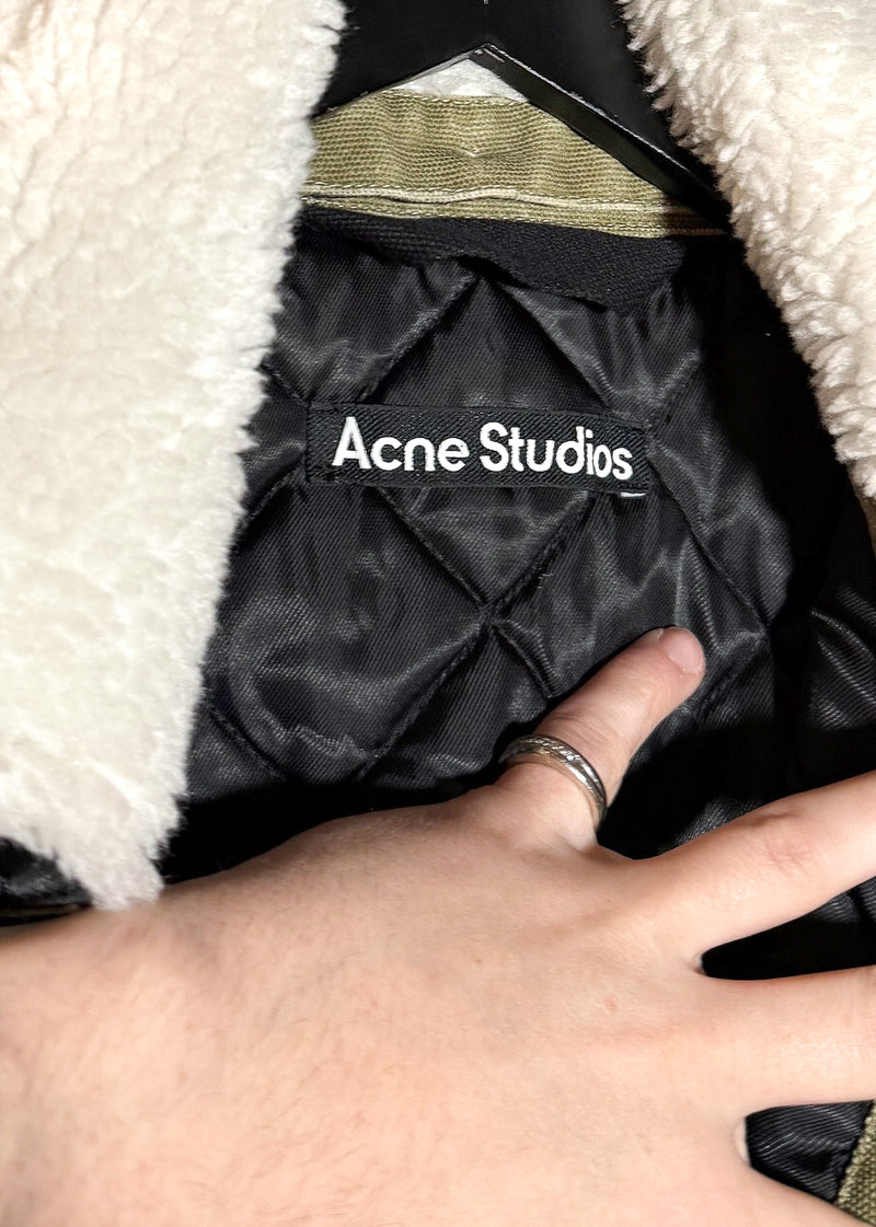 Brand label and quilted lining of Acne Studios Green Canvas Faux Shearling Orsan Trucker Jacket