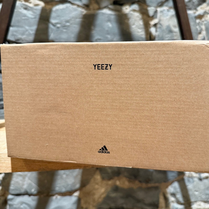 Packaging of Adidas YEEZY 350 Cleat Turtle Dove American Football Sneakers