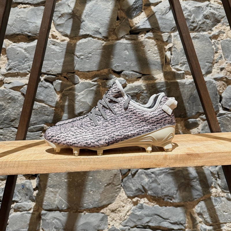 Side of Adidas YEEZY 350 Cleat Turtle Dove American Football Sneakers