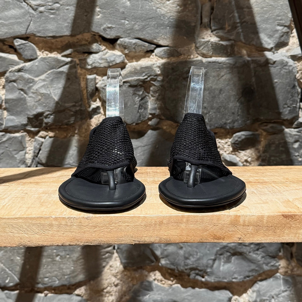 Front view of Alaïa Black Fishnet Mesh Thong Sandals