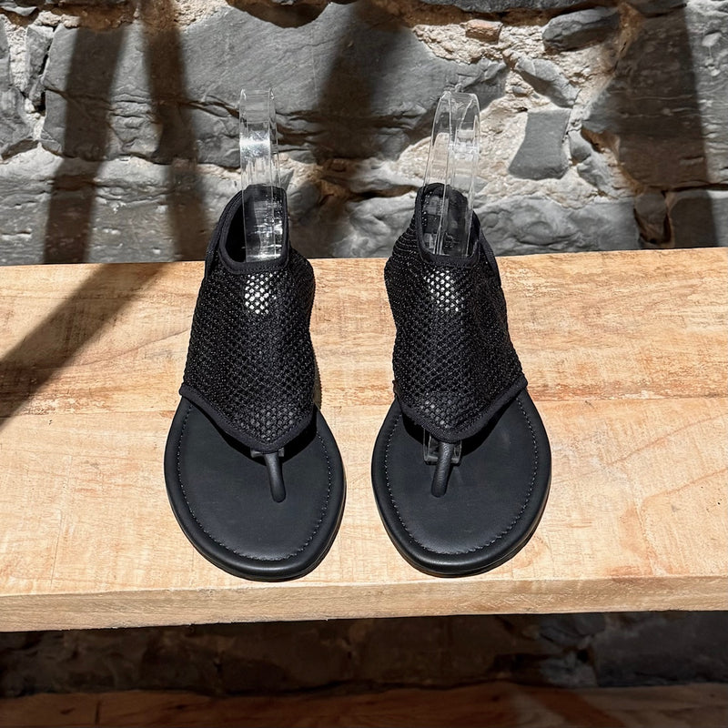 Top view of Alaïa Black Fishnet Mesh Thong Sandals