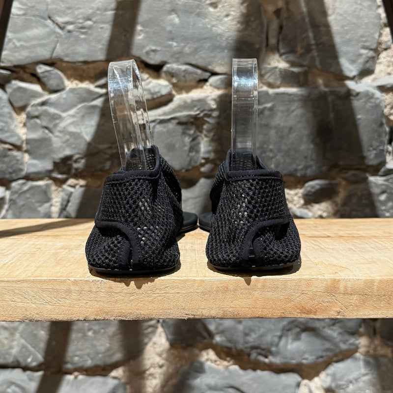 Back view of Alaïa Black Fishnet Mesh Thong Sandals