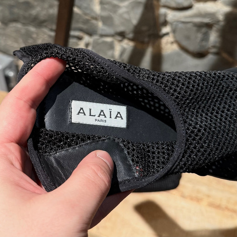 Branded insole of Alaïa Black Fishnet Mesh Thong Sandals