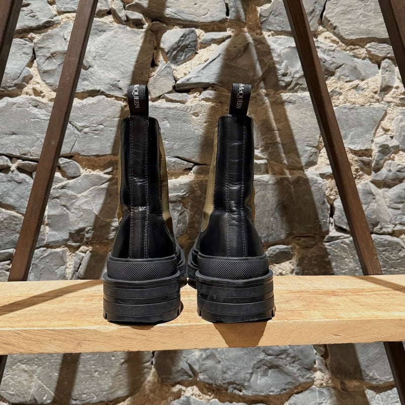 Back view of Alexander McQueen Black Leather Khaki Tread Slick Chelsea Boots