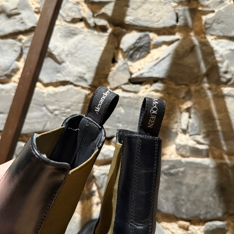 Branded pull tabs of Alexander McQueen Black Leather Khaki Tread Slick Chelsea Boots