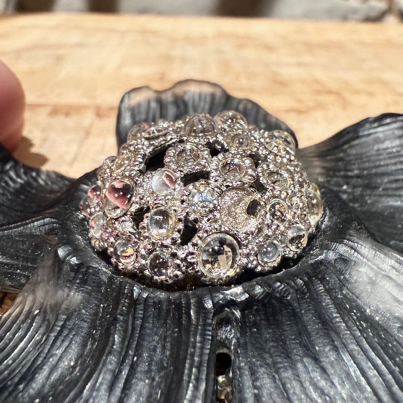 Close-up on Alexis Bittar Crystal Embellished Black Floral Brooch