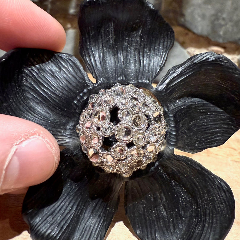 Close-up on Alexis Bittar Crystal Embellished Black Floral Brooch