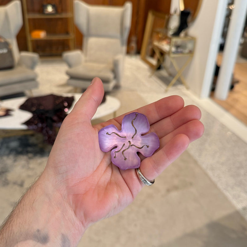 Alexis Bittar Lilac Floral Brooch held in a hand