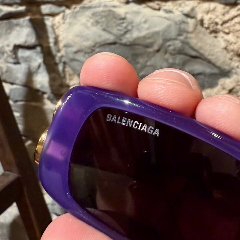 silver-tone engraved Brad  logo on the black lens of Balenciaga BB0096S Purple Dynasty Rectangular Sunglasses