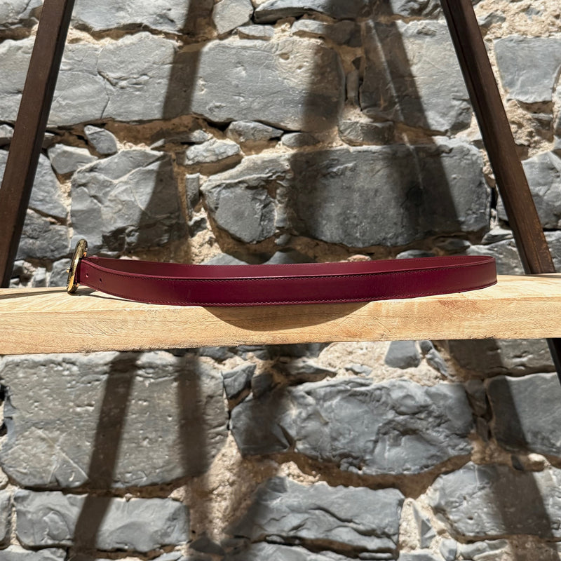 A side view of Bottega Veneta Burgundy Leather Gold Drop Buckle Thin Belt