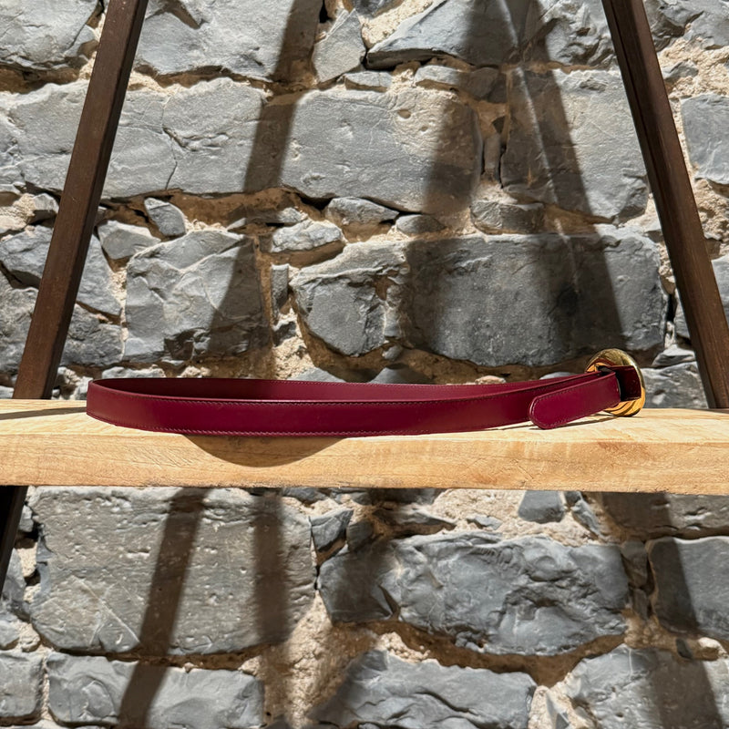 A side view of Bottega Veneta Burgundy Leather Gold Drop Buckle Thin Belt