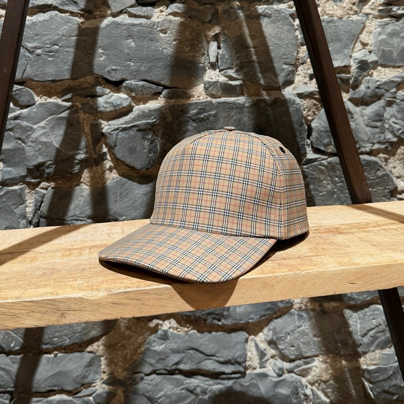 Side front view of Burberry Beige Micro Check Trucker Cap
