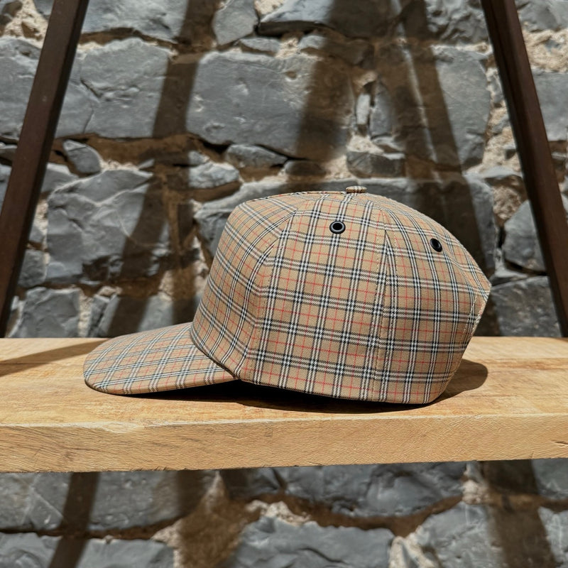 A side view of Burberry Beige Micro Check Trucker Cap