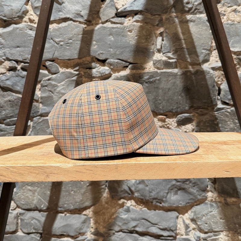 A side view of Burberry Beige Micro Check Trucker Cap