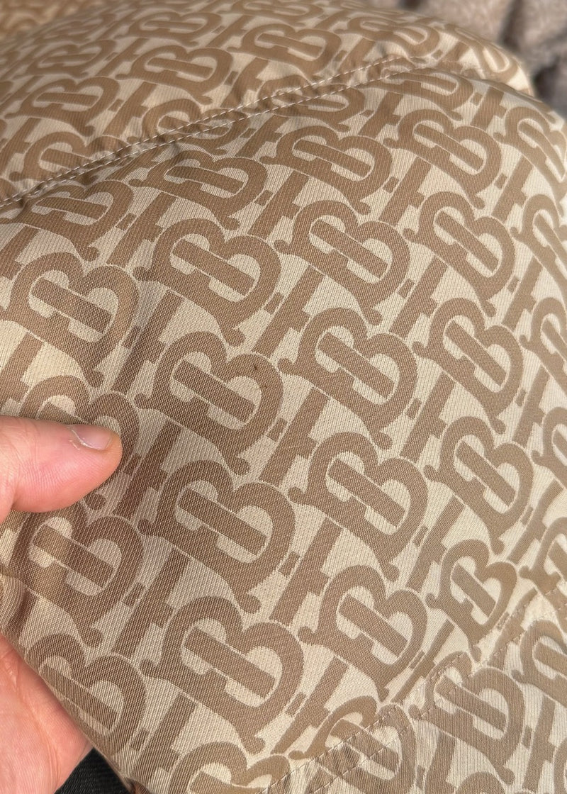 Close-up on Burberry Beige Monogram Jacquard Down Puffer Coat