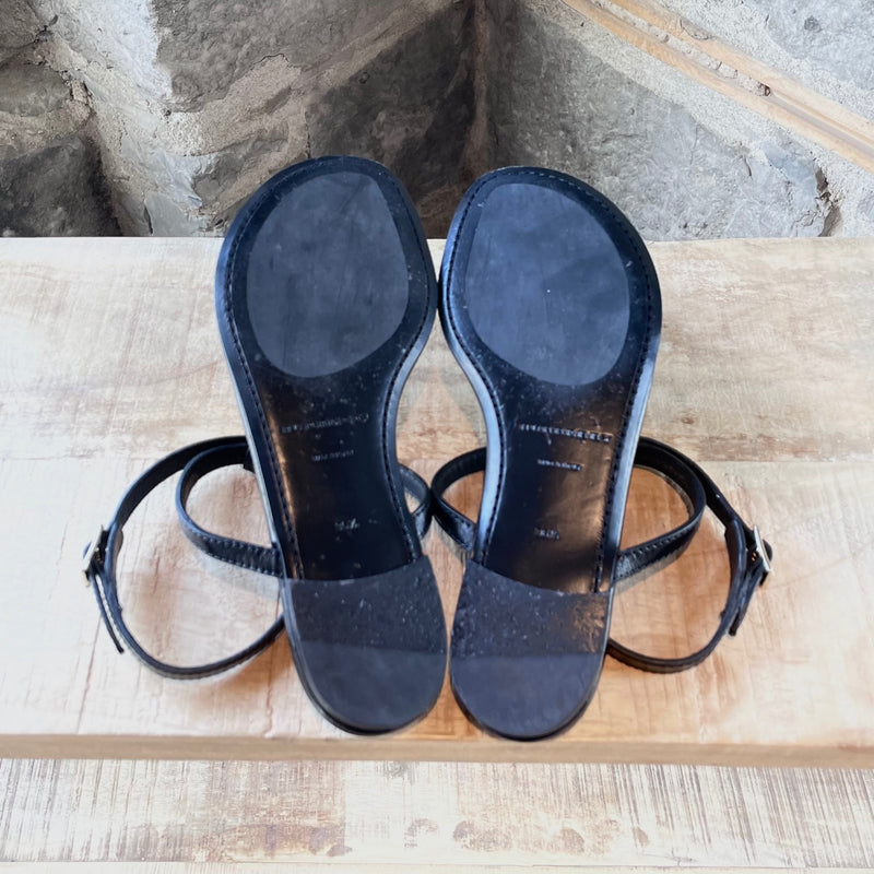 Outsoles of Burberry Black Leather Clasp Accent Thong Sandals