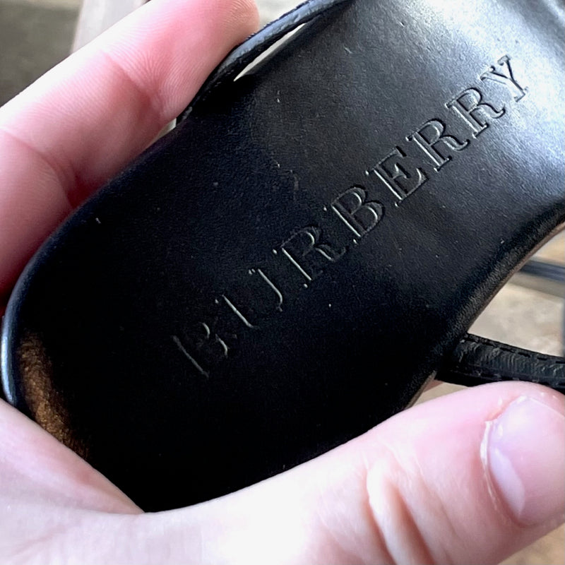 One Branded insole of Burberry Black Leather Clasp Accent Thong Sandals