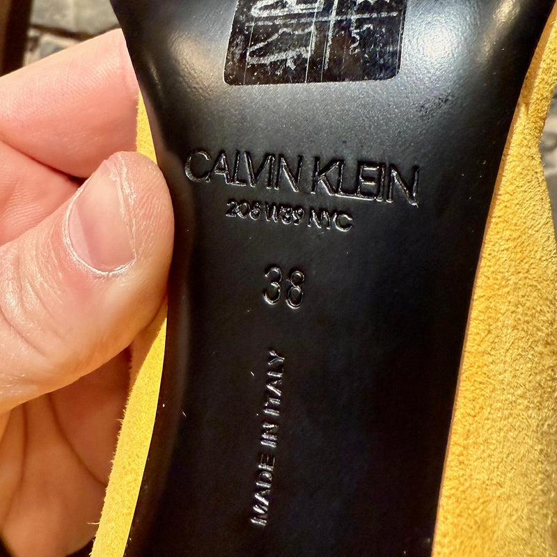 Brand, size and origin embossed outsole stamp of Calvin Klein 205W39NYC Yellow Suede Leititia Pumps