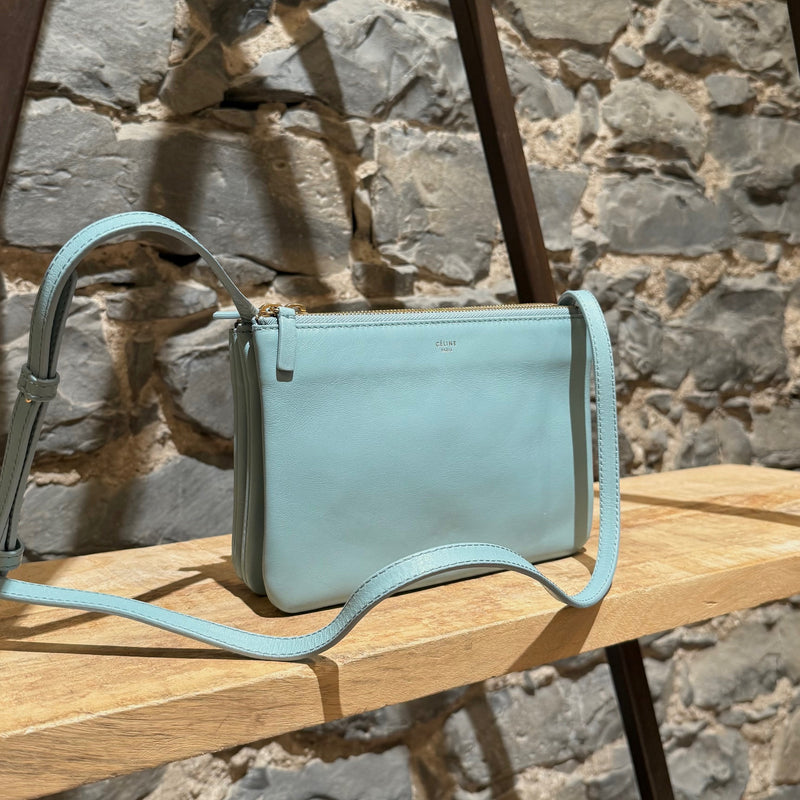 Side front view of Céline Light Blue Small Trio Crossbody Bag