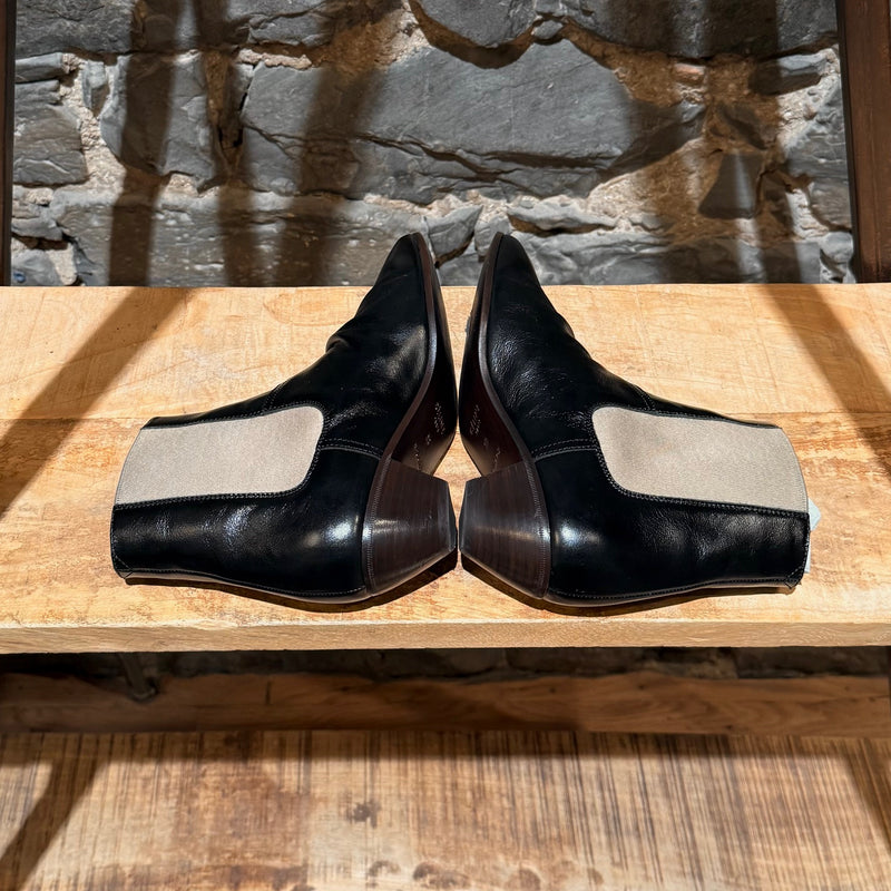 Side-by-side view of Céline SS18 Black Leather Chelsea Boots