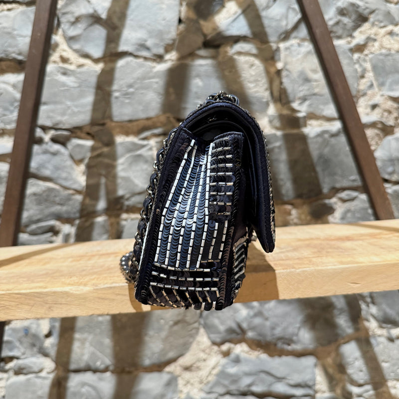 A side view of Chanel 2015-2016 Navy Blue Satin Sequin Beaded Medium Double Flap Bag