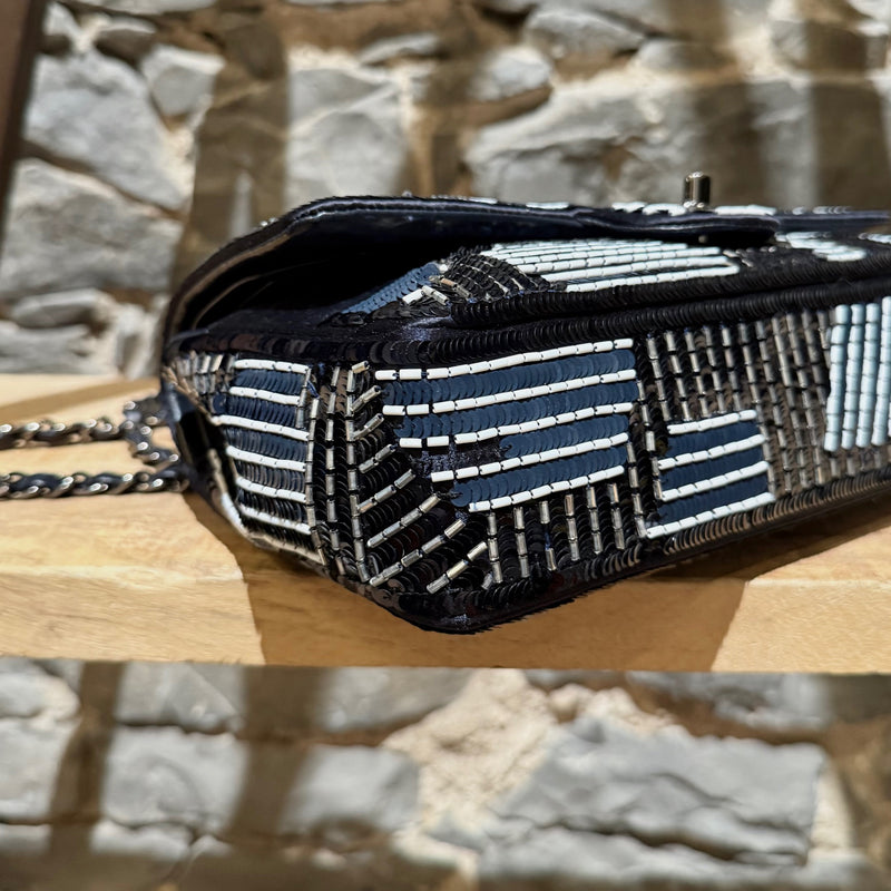 A bottom corner of Chanel 2015-2016 Navy Blue Satin Sequin Beaded Medium Double Flap Bag