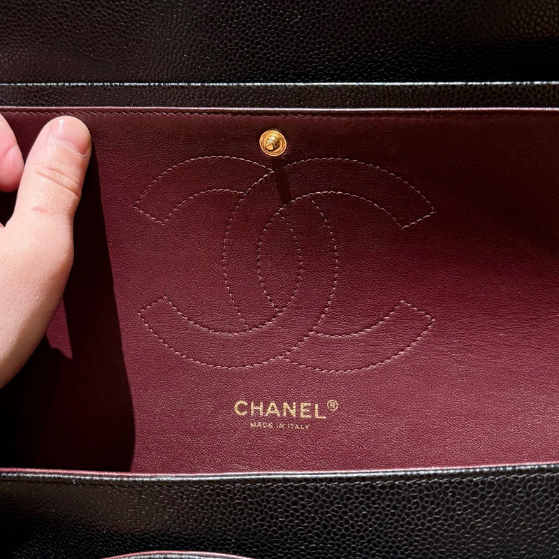 Brand stamp of Chanel Black Caviar Jumbo GHW Classic Double Flap Bag