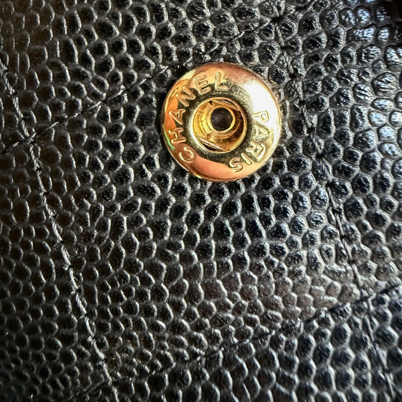 Branded hardware of Chanel Black Caviar Jumbo GHW Classic Double Flap Bag