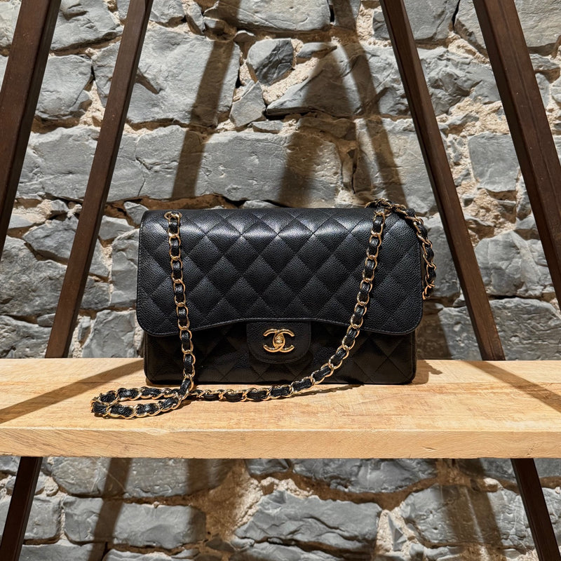 Front view of Chanel Black Caviar Jumbo GHW Classic Double Flap Bag