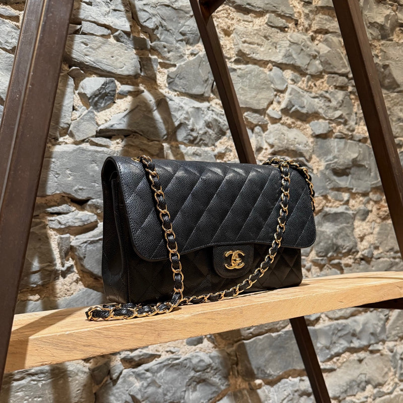 Side front view of Chanel Black Caviar Jumbo GHW Classic Double Flap Bag