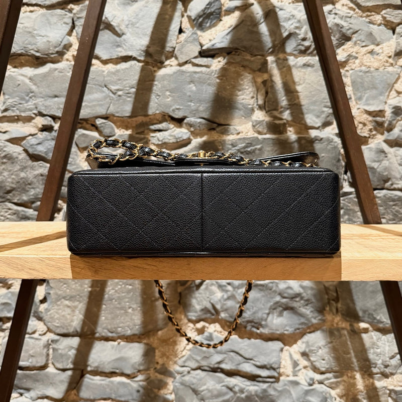 Bottom view of Chanel Black Caviar Jumbo GHW Classic Double Flap Bag