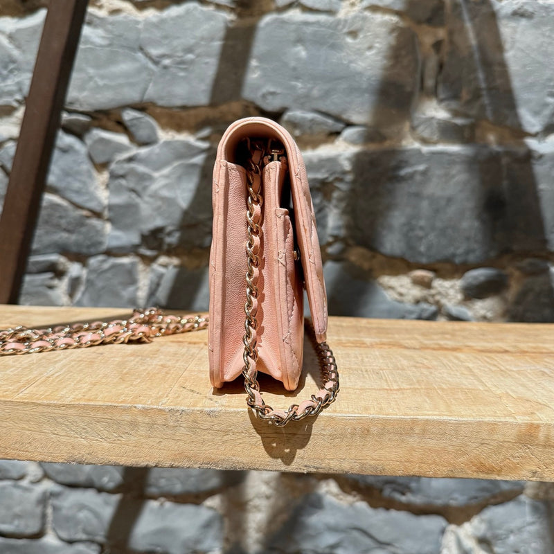 A side view of Chanel 2021 Pink Lambskin Quilted CC Classic Wallet On Chain