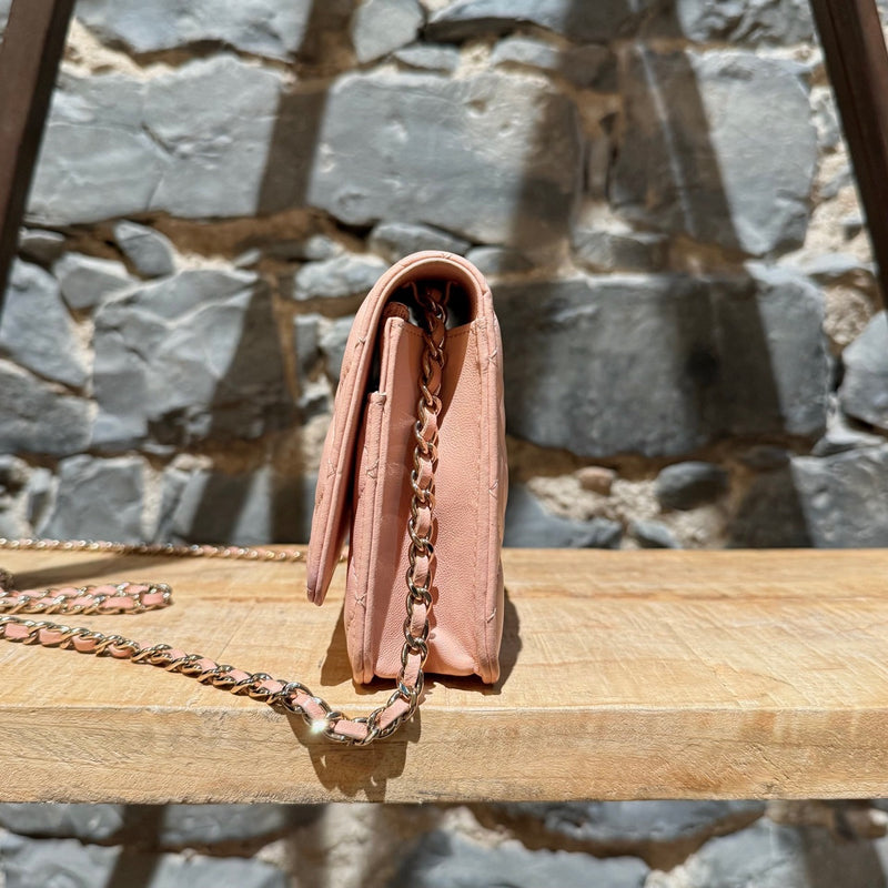 A side view of Chanel 2021 Pink Lambskin Quilted CC Classic Wallet On Chain