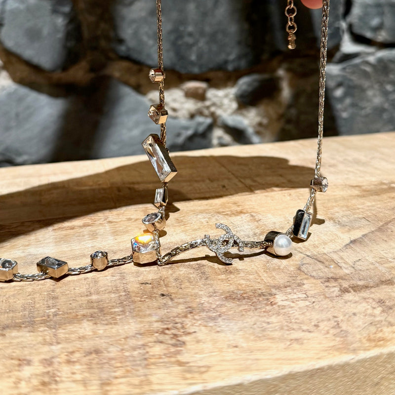 Close-up on Chanel 22C Champagne Gold Crystals Pearls CC Chain Drop Necklace