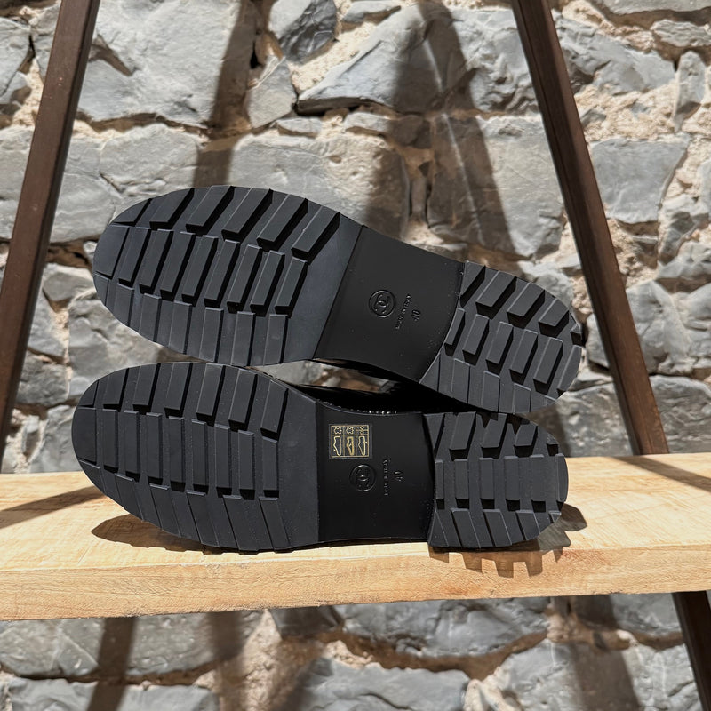 Branded outsole of Chanel Back Glossy Pearl Chain Embellished Combat Boots