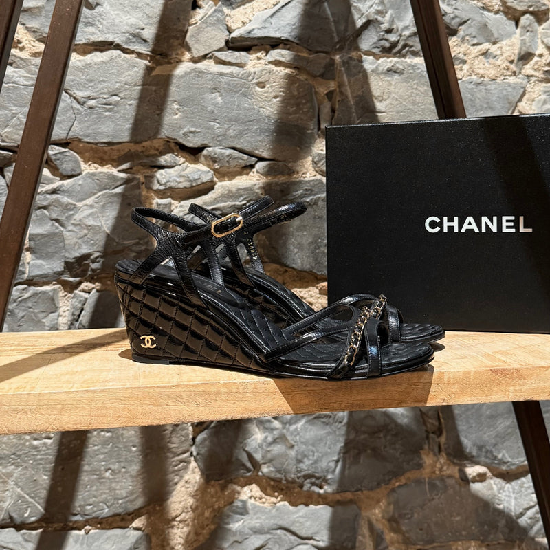 Main photo of Chanel Black Crumpled Leather Chain Accent Quilted Wedge Sandals