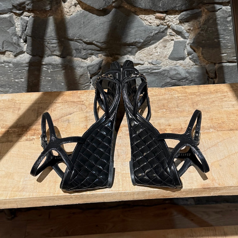 Side-by-side view of Chanel Black Crumpled Leather Chain Accent Quilted Wedge Sandals