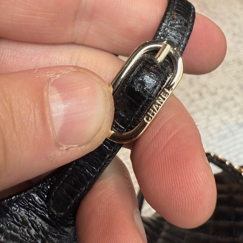 Branded hardware of Chanel Black Crumpled Leather Chain Accent Quilted Wedge Sandals