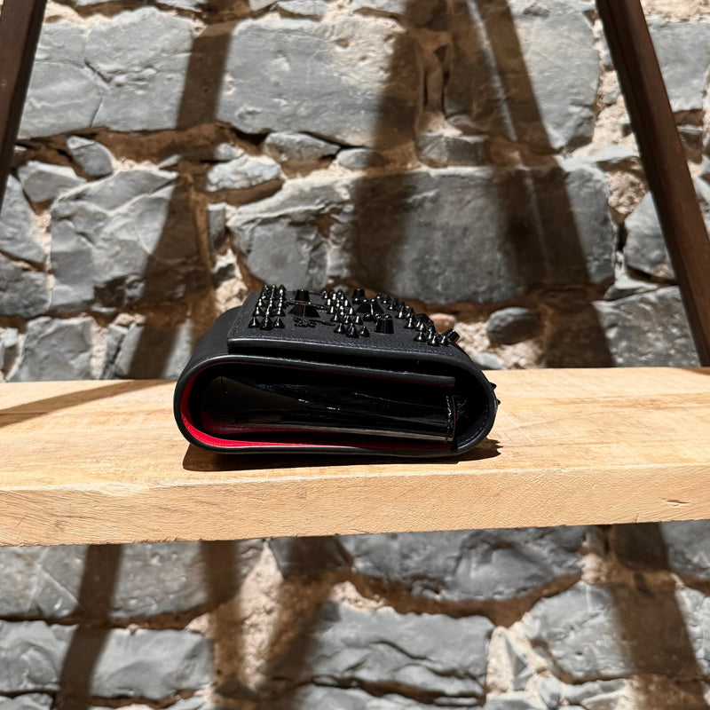 A side view of Christian Louboutin Black Leather Paloma Shoulder Bag