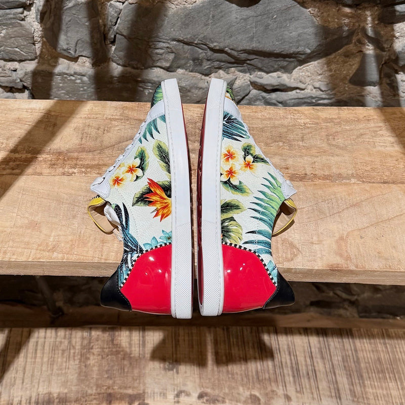 Side view of Christian Louboutin Floral Patent Seava Low-Top Sneakers showcasing vibrant floral print and signature red sole.