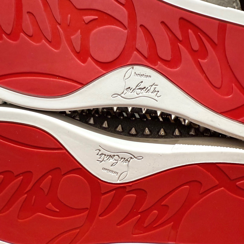 Branded red outsoles of Christian Louboutin Silver Glitter Pik Boat Slip-on Sneakers