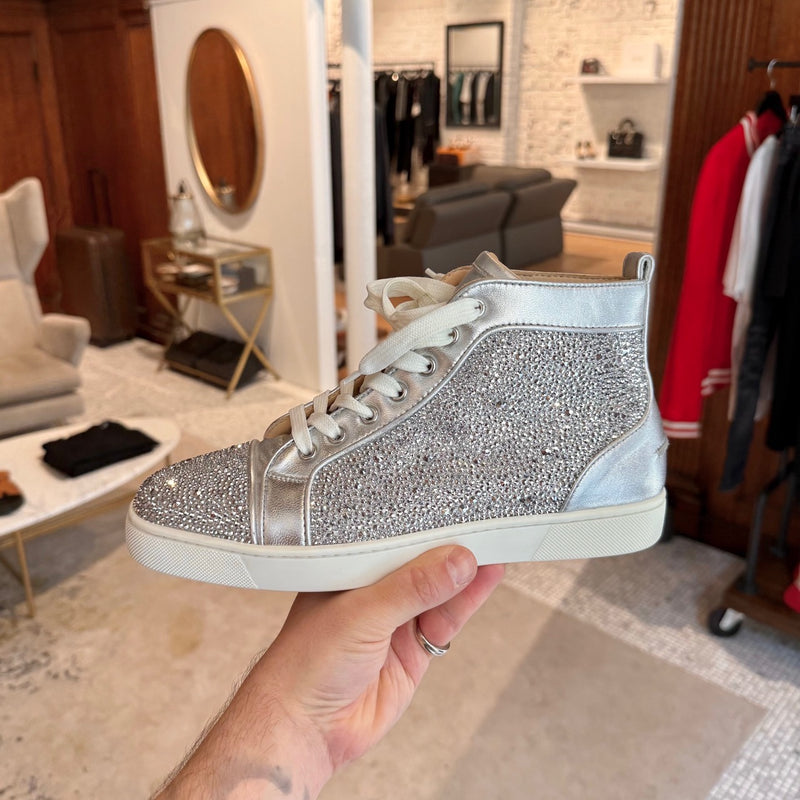 A side view of Christian Louboutin Silver Leather Louis Strass High-top Sneakers