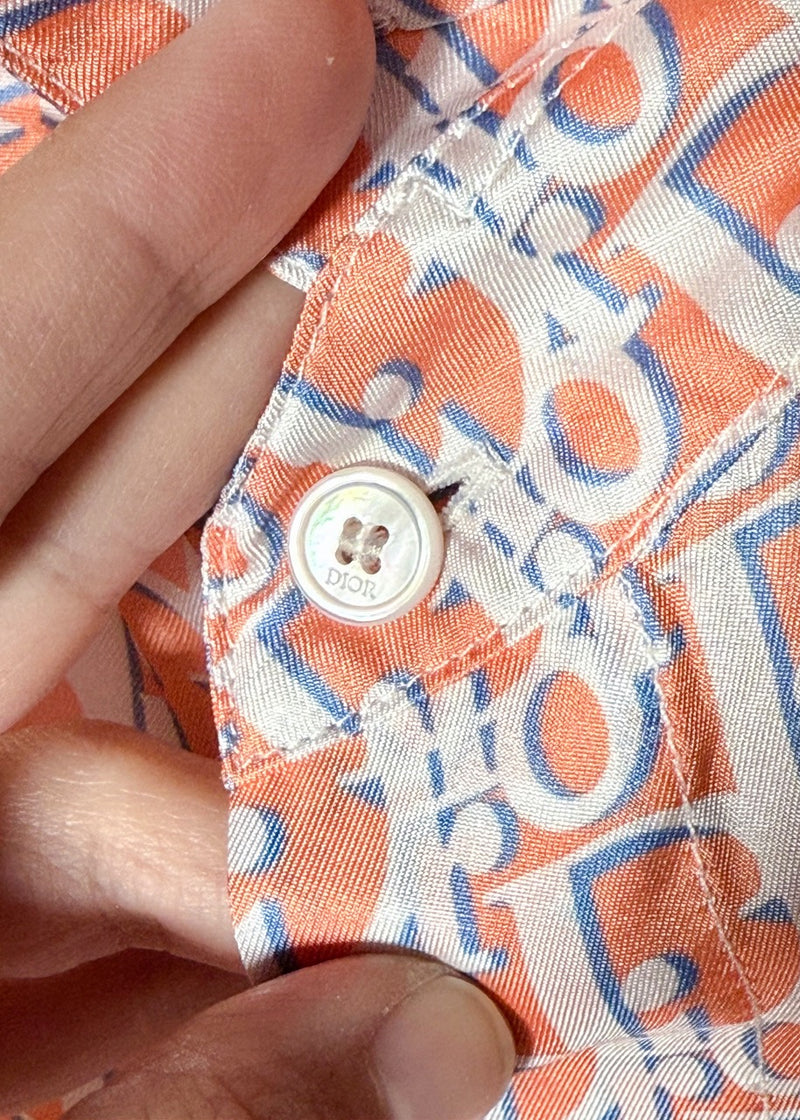 Button close up of Dior 2021 Orange Blue Oblique Satin Silk Short Sleeves Shirt