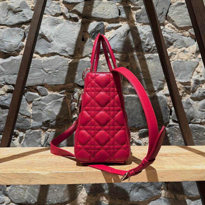 A side view of Dior 2022 Fuchsia Pink Lambskin Cannage Medium Lady Dior Handbag