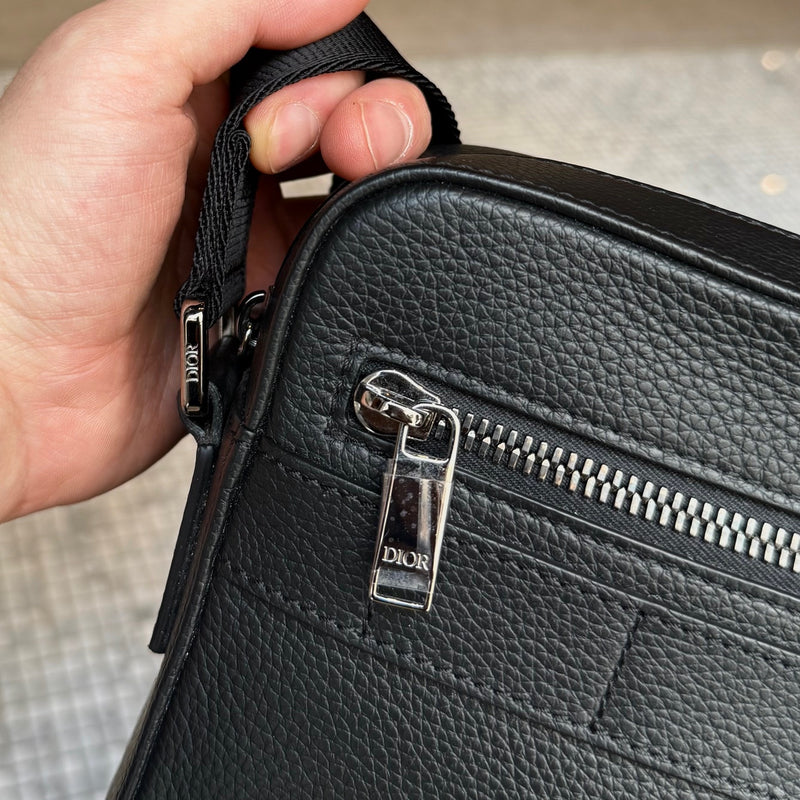 Branded hardware of Dior Black Grained Leather Maxi Safari Messenger Bag