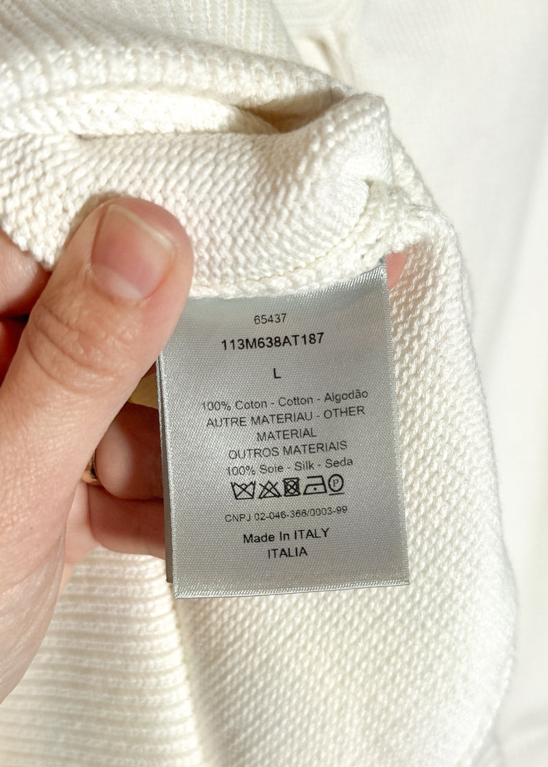 Material, care and origin label of Dior Ivory Cotton Oblique Sleeves Knit Sweater