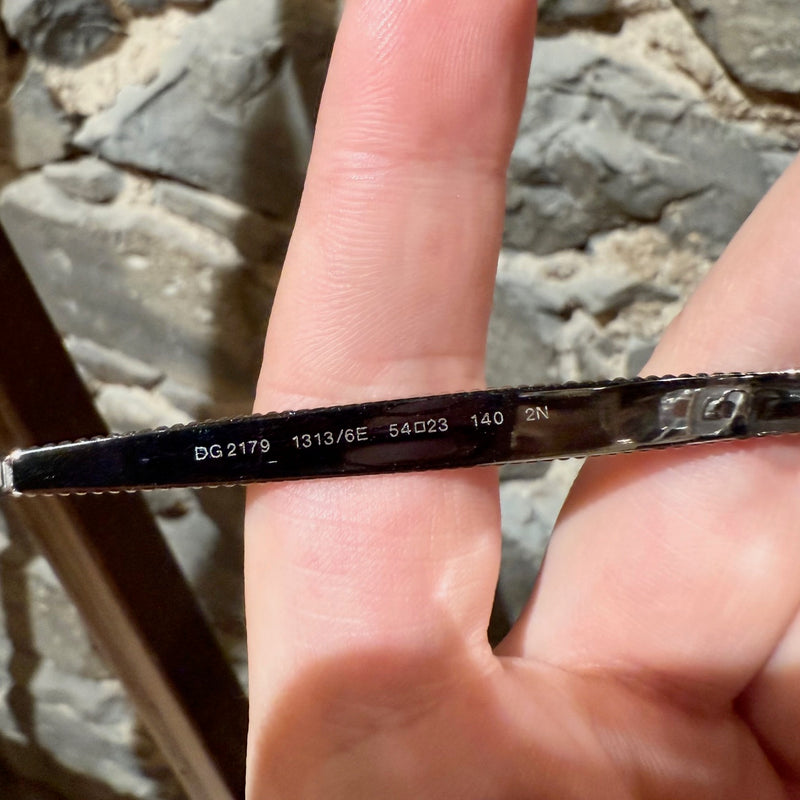 Interior branch of Dolce & Gabbana DG2179 Gold Round Metal Sunglasses