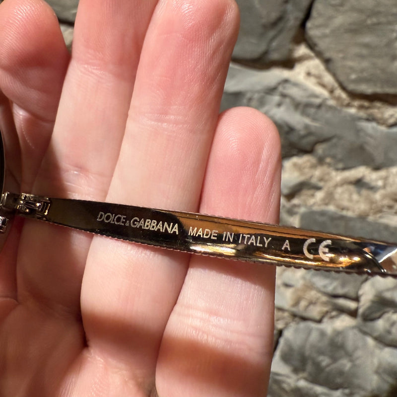 Interior branch of Dolce & Gabbana DG2179 Gold Round Metal Sunglasses